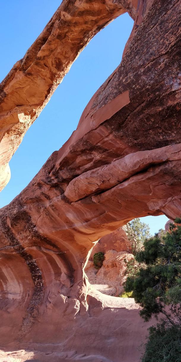 Under the Double O arch in Arches National park 