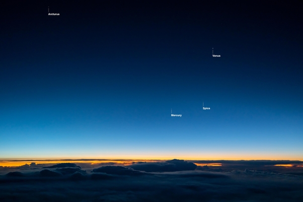 Venus and Mercury at dawn through an airplane window