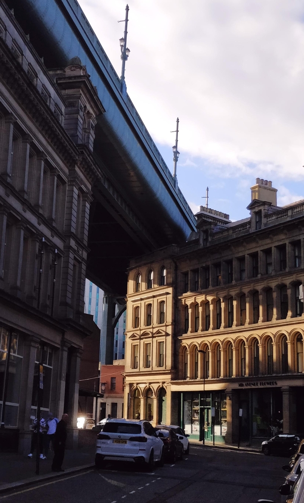 Victorian buildings and streets under the Tyne Bridge in Newcastle