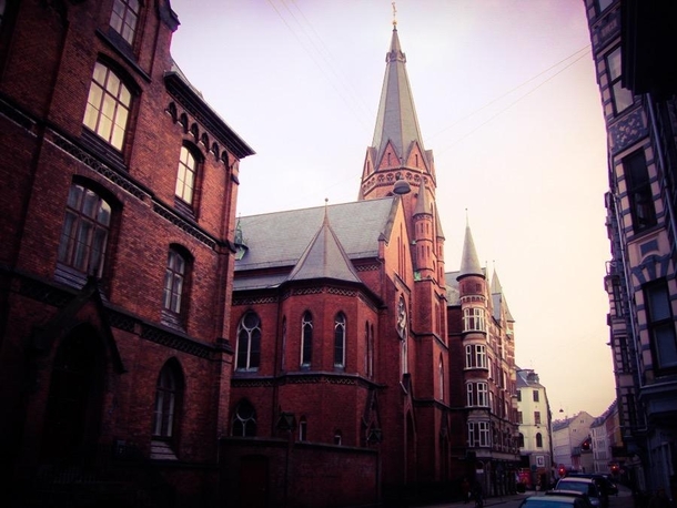 View from down the street of Jesu Hjerte Kirke Sacred Heart of Jesus Catholic Church in Copenhagen Denmark 
