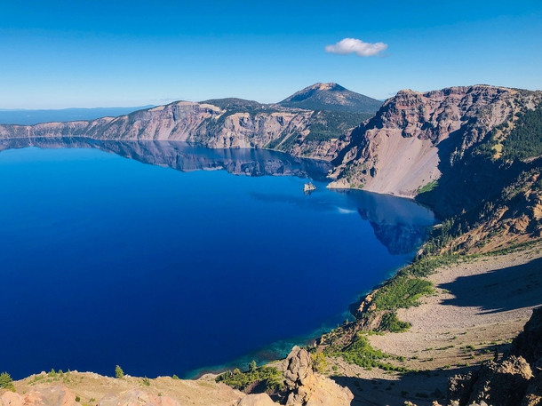 Views of Crater Lake from the Garfield Peak hike The phantom ship rock in the water is ft tall to add perspective 