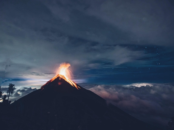 Volcanic eruptions above the clouds and below the stars in Guatemala  by IG danielbenjaminphoto