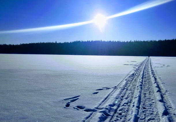 Walking across frozen lake in Finland