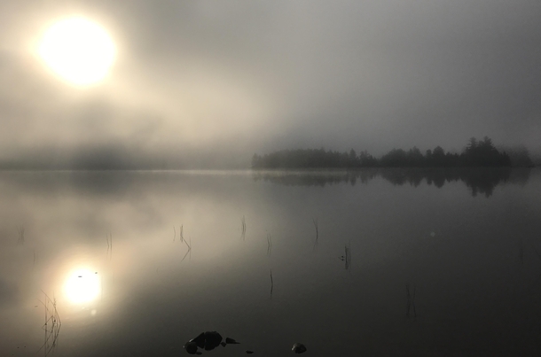 Watching the sunrise burn away the mist over Lower Jo-Mary Lake Maine 