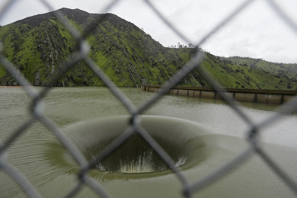 Water flows into the iconic Glory Hole spillway at Monticello Dam in Lake Berryessa California Water is flowing for the first time in over a decade into the -foot diameter hole due to the recent storms in California 