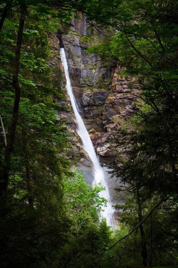Waterfall in a tree-lined window Lauterbrunnen Valley Swiss Alps  x