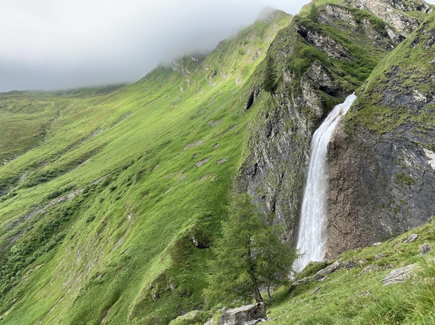 Waterfall with clouds at the mountain peaks - Peter Habeler runde hike - Austria 