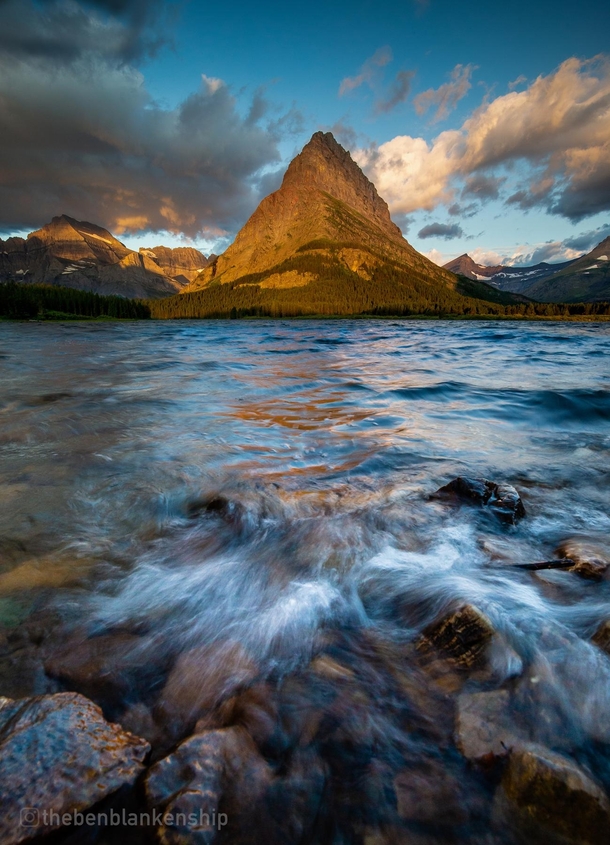 Waves crash in Swiftcurrent Lake with Grinnel Point in the background Glacier National Park 