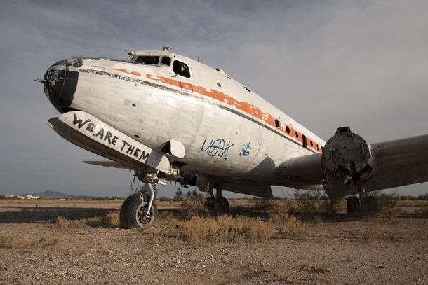 WE ARE THEM Abandoned airplane with graffiti near Airport Mesa AZ by Jrmy RONDAN 