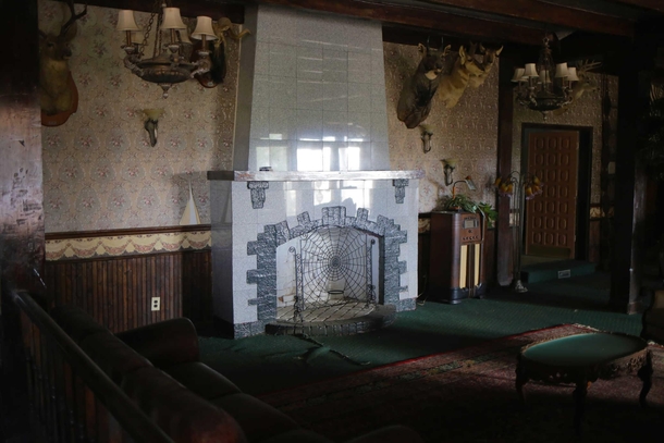 White fireplace from inside abandoned s era speakeasy