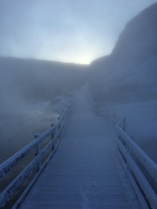 Winter steam rising over the boardwalk at dawn near Mammoth Yellowstone National Park 