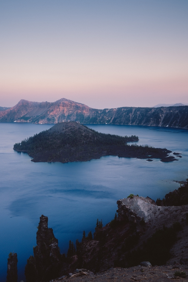 Wizard Island inside Crater Lake OR at sunset 