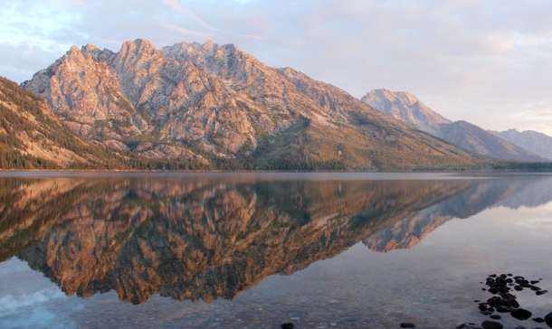 Woke up early to catch the sunrise at Jenny Lake in Grand Teton National Park I didnt expect it to be so perfect 