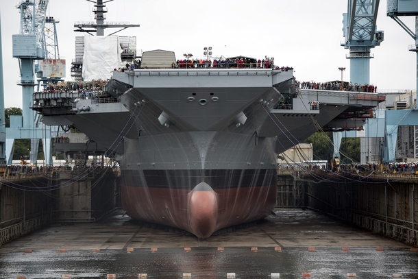Worlds largest aircraft carrier and the largest warship USS Gerald R Ford sitting in drydock during construction Flight deck  ft   ft  m   m for  aircraft Displacement  tons
