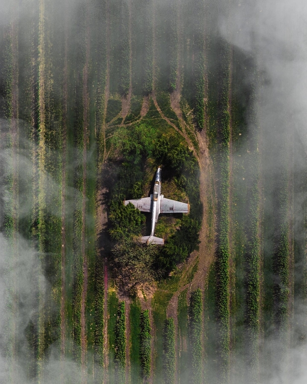 X-post An actual image of a PZL TS- Iskra hidden away in the middle of the polish countryside Photo credit  Tom Dolmann