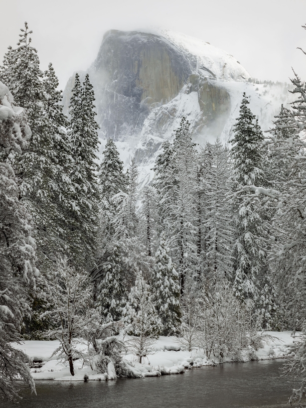 Yosemites Half Dome in the snow and fog 
