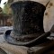A forgotten top hat among the ruins of a house 