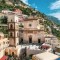 Church of Santa Maria Assunta and the th century bell tower in the hillside village of Positano on the Amalfi Coast Campania Italy