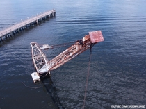  Abandoned crane and barge sunken into the river   