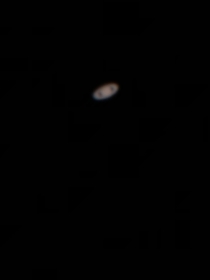  Saturn though a telescope eyepiece