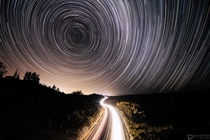  Star trails over a highway New Zealand