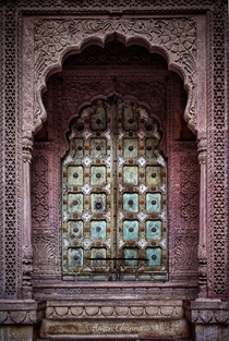 A beautifully carved door at Mehrangarh Fort Palace Jodhpur BharatIndia