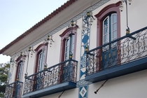 A colonial townhouse in the historical center of Paraty RJ Brazil The pineapples were a symbol of nobility and the details on the pilasters denote that a member of the masonry lived there