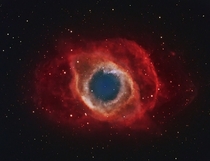 A Cosmic Eye The Helix Nebula NGC  is a planetary nebula in Aquarius the Water-bearer that formed when a Sun-like star reached the end of its life and expelled an expanding cloud of gas