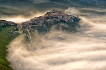 A dense fog engulfs Castelluccio Italy 