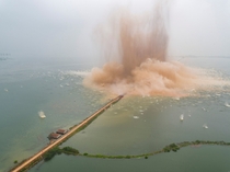 A dike between two lakes is demolished in Wuhan China 