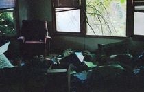 a film photo from inside an abandoned house still filled with inhabitants belongings it was abandoned in 