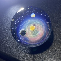 A galaxy glass marble OC