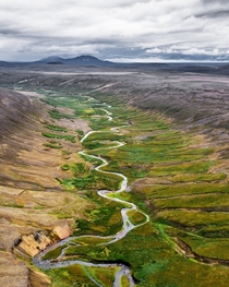 A glacial river forming this beautiful riverbed in Iceland  - Insta glacionaut