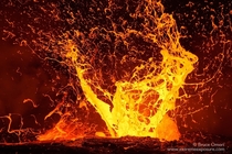 A huge lava bubble explodes sending sheets of expanding molten rock airborne HI Photo by Bruce Omori 
