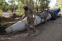 A Libyan fighter looks at an abandoned Scud missile near Abu Adi Sept  