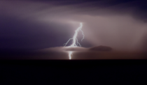 A lightning bolt over the sea in a cloud  x