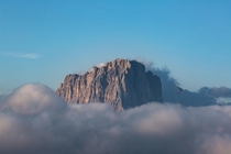 A majestic mountain top rising above the clouds in the Dolomites Italy 