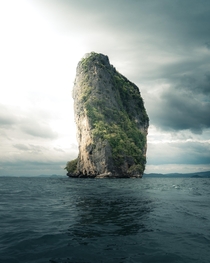 A massive cliff formation rising out of nowhere in the Andaman Sea near Krabi Thailand  IG mvttmic