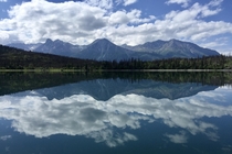 A mirror-like Lake Clark reflects the scenery Lake Clark National Park Alaska 