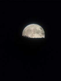 A moonrise through a birdwatching telescope 