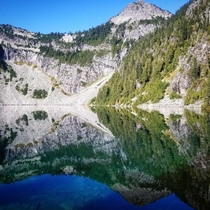 A near perfect reflection on Copper Lake Alpine Lakes Wilderness WA 