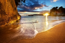 A New Zealand Sunrise at Cathedral Cove by Daniel Peckham 