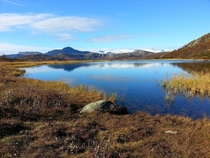 A Norwegian mountain-lake reflecting the mountains 