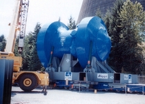 A nuclear reactor pressure vessel being hauled away during the decommissioning process  