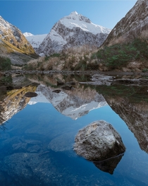 A perfect reflection at a stream near Milford Sound New Zealand  IG ImagesByDJ