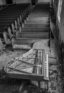 A piano in great shape inside this abandoned church
