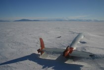 A plane lies abandoned slowly fading away into the Antarctic ice 