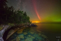 A proton arc a rare type of aurora appeared over lake Superior When massive amounts of protons bombards the Earths atmosphere following an energetic event on the Sun this kind of aurora is created