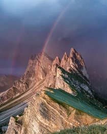 A rainbow before the storm over Seceda Italy 
