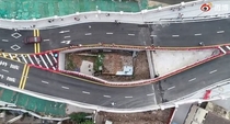 A road bridge has just been built around a small house in Chinas Guangdong province The owner refused to sell his property to the government for  years The bridge was therefore diverted